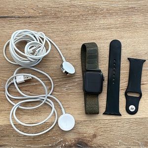 Apple Watch Series 5 with 2 wristbands and  1 charger.